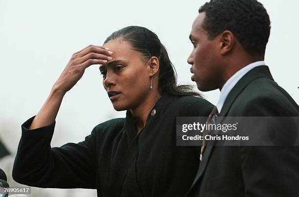 Obadle Marion Jones stands with her husband Obadele Thompson after she... News ...