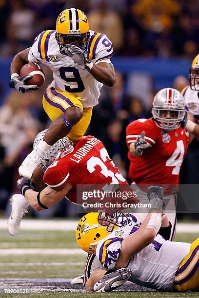 Early Doucet of of the Louisiana State University Tigers runs with the ball against James Laurinaitis of the Ohio State Buckeyes during the AllState...