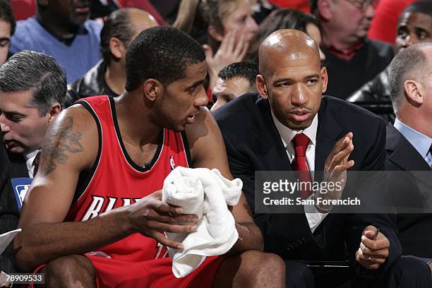 LaMarcus Aldridge of the Portland Trail Blazers listens to assistant coach Monty Williams during the game against the Seattle SuperSonics at the Rose...