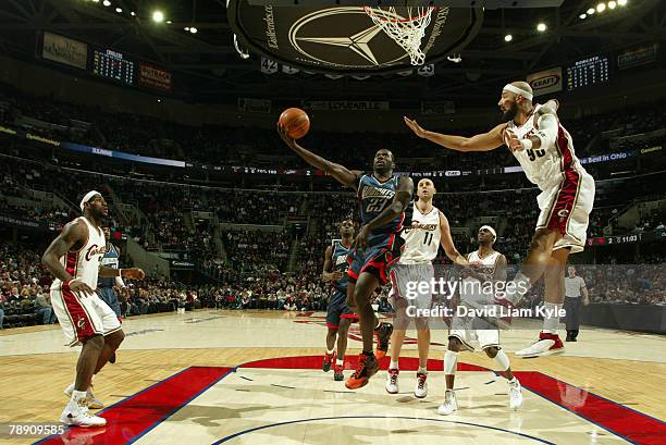 Jason Richardson of the Charlotte Bobcats goes up for the layup against Drew Gooden of the Cleveland Cavaliers at the Quicken Loans Arena January 11,...