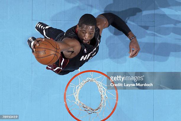 Dwyane Wade of the Miami Heat dunks over the New Orleans Hornets on January 11, 2008 at the New Orleans Arena in New Orleans, Louisiana. NOTE TO...