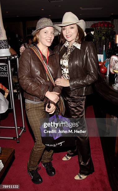 Katy Kass and Joan Collins attends the Secret Room Celebrity Gifting Suite Day 2 for the 66th Annual Golden Globe Awards at Metro Couture on January...