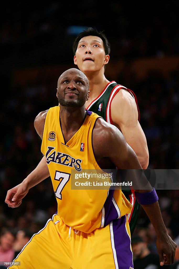 Lamar Odom Of The Los Angeles Lakers And Yi Jianlian Of The Milwaukee lamar-odom-of-the-los-angeles-lakers-and-yi-jianlian-of-the-milwaukee