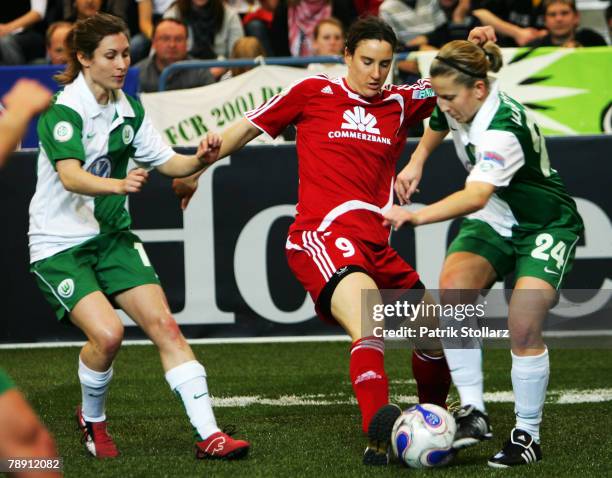 Birgit Prinz of Frankfurt fights Shelley Thompson and Juliane Hoefler during the Women's Indoor T-Home Cup match between VfL Wolfsburg and 1.FFC...