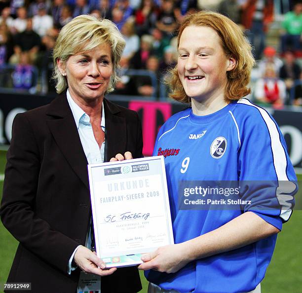 Melanie Behringer of Freiburg receive the Fairplay Trophy from Headcoach of the German Team Silvia Neid after Women's Indoor T-Home Cup final match...