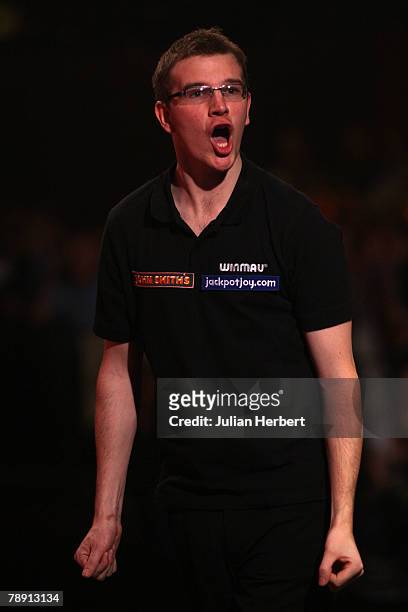 Mark Webster of Wales celebrates during his game against Martin Adams of England during the Semi Finals of The World Professional Darts Championship...