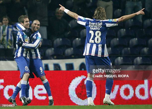 Porto's Raul Meireles, Argentinian Lisandro Lopez and Brazilian Adriano Louzada celebrate after scoring the second goal against SC Braga during their...