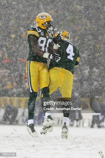 Wide receiver Donald Driver and quarterback Brett Favre of the Green Bay Packers celebrate after running back Ryan Grant scored on a one-yard run in...