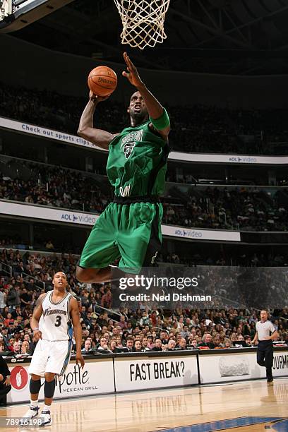 Kevin Garnett of the Boston Celtics dunks against Caron Butler of the Washington Wizards at the Verizon Center January 12, 2008 in Washington, DC....