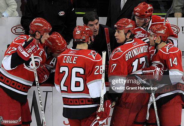 Coach Peter Laviolette of the Carolina Hurricanes huddles with his team during a timeout in the final seconds of a 5-4 loss to the Colorado Avalanche...