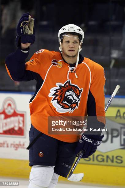 Right wing Kyle Okposo of the Bridgeport Sound Tigers salutes the crowd after being named the star of the game against the Springfield Falcons at...