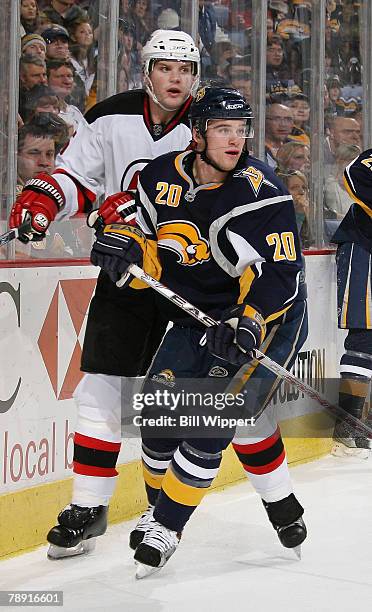 Daniel Paille of the Buffalo Sabres skates against Colin White of the New Jersey Devils on January 12, 2008 at HSBC Arena in Buffalo, New York.