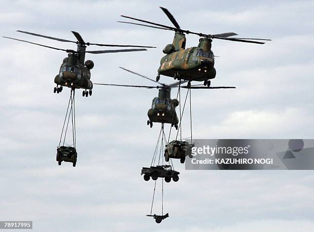 Chinook helicopters carry vehicles during an annual new year exercise by Ground Self-Defense Force 1st Airborne Brigade in Narashino, Chiba...
