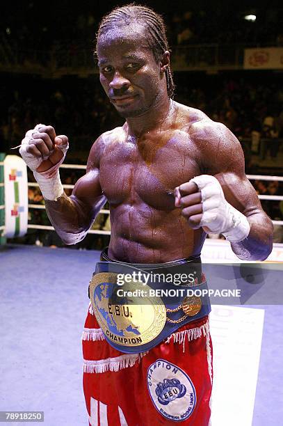 Belgian Sugar Jackson Osei Bonsu celebrates after winning against French Brice Faradji during 'The Night of the Fight II' fight, 12 January 2008 in...