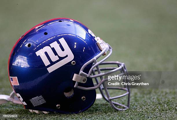 New York Giants helmet sits on the field before the NFC Divisional Playoff game against the Dallas Cowboys at Texas Stadium on January 13, 2008 in...