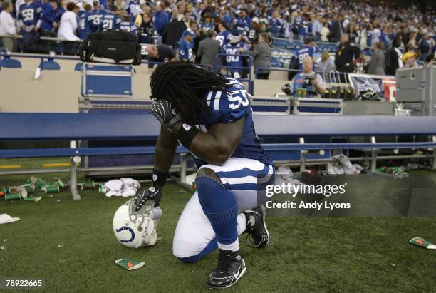 Clint Session of the Indianapolis Colts kneels dejected on the sideline after their 28-24 loss against the San Diego Chargers during their AFC...