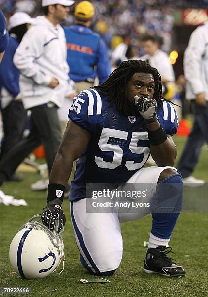 Clint Session of the Indianapolis Colts kneels dejected on the sideline after their 28-24 loss against the San Diego Chargers during their AFC...