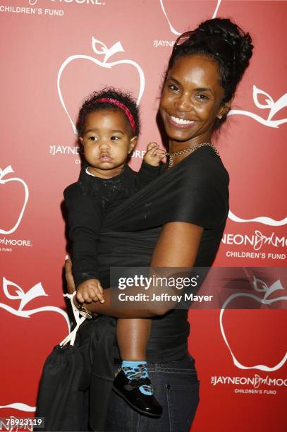 Kim Porter and daughter attend the Boom Boom Room Gifting Wonderland at the Century Plaza Hotel on January 12, 2008 in Century City California.