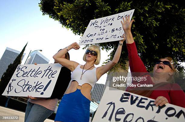 Film and Television below the line crew workers protest the WGA strike outside the Beverly Hilton prior to the 65th Annual Golden Globe Awards press...