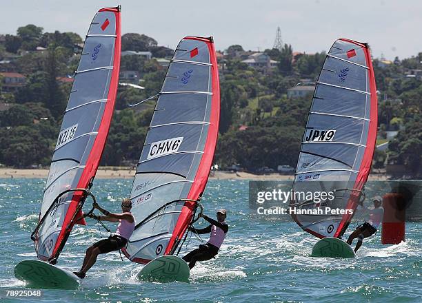 Barbara Kendall of New Zealand, Mingli Duan of China and Yasuko Kosuge of Japan race up to the bottom mark on day two in Women's RSX Windsurfing...