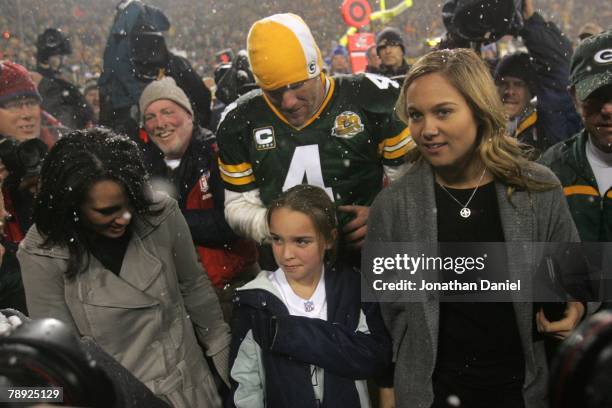 Quarterback Brett Favre of the Green Bay Packers walks off the field with his wife Deanna and daughters Brittany and Breleigh after the Packers...