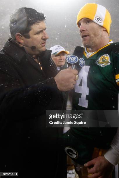 Quarterback Brett Favre of the Green Bay Packers is interviewed after the game against the Seattle Seahawks by sideline reporter Tony Siragusa of Fox...