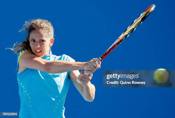 Patty Schnyder of Switzerland plays a backhand during her first round match against Lilia Osterloh of the United States of America on day one of the...