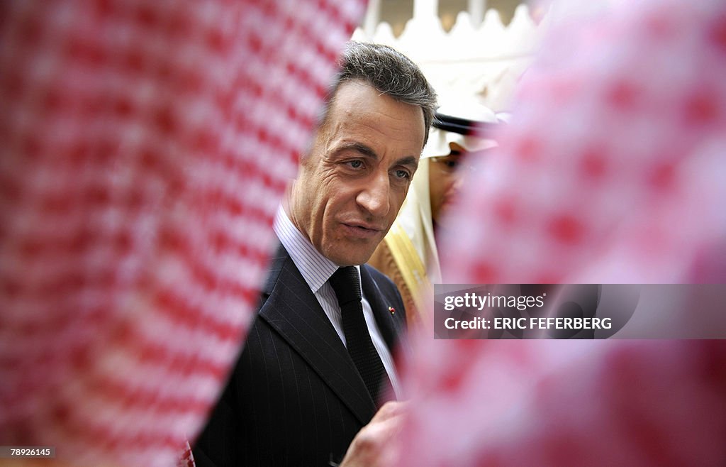French President Nicolas Sarkozy talks w
