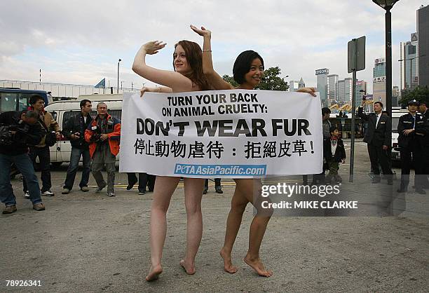 Activists from People for the Ethical Treatment of Animals hold a demonstration at the Hong Kong Fashion Week after disrupting a seminar on "Let Fur...