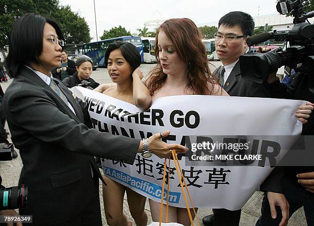 Activists from People for the Ethical Treatment of Animals hold a demonstration at the Hong Kong Fashion Week after disrupting a seminar on "Let Fur...