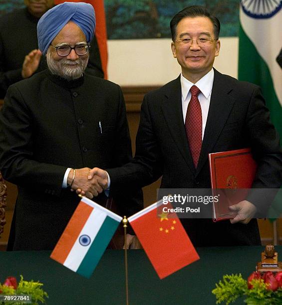 Indian Prime Minister Manmohan Singh, and Chinese Premier Wen Jiabao, shake hands after a signing ceremony held at the Great Hall of the People on...