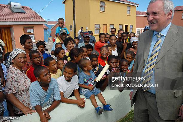 Irish Prime Minister Bertie Ahem greets residents of Tafelsig, an impoverished area, about 20km from the centre of Cape Town, where the Niall Mellon...