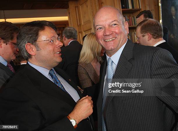 Deutsche Entertainment AG Chairman Peter Schwenkow chats with Air Berlin head Joachim Hunold at the annual New Year Reception at German publishing...