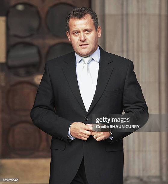 British former butler Paul Burrell poses for the media outside London's High Court, in central London, 14 January 2008, during the inquest into the...