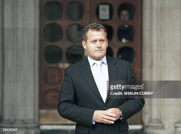 British former butler Paul Burrell poses for the media outside London's High Court, in central London, 14 January 2008, during the inquest into the...
