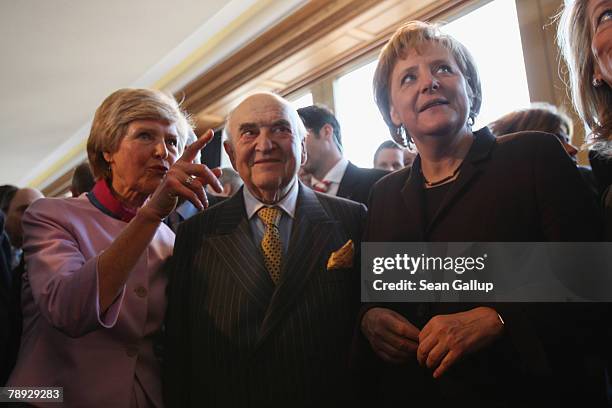 Axel Springer publishing house Deputy Chairwoman Friede Springer, Lord Weidenfeld and German Chancellor Angela Merkel attend the annual New Year...