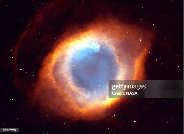 This photograph of the coil-shaped Helix Nebula is one of the largest and most detailed celestial images ever made. The composite picture is a...