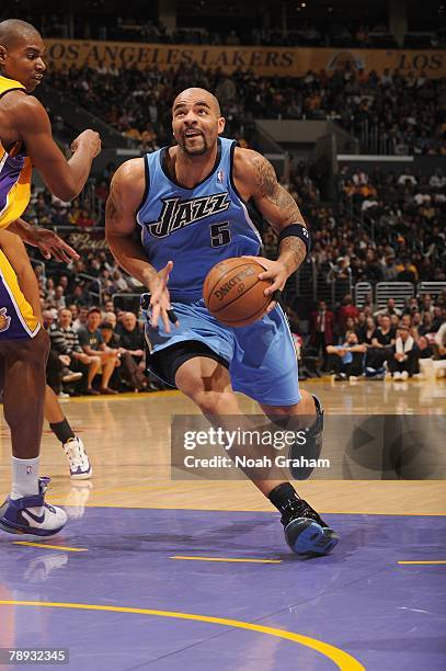 Carlos Boozer of the Utah Jazz drives down the lane against the Los Angeles Lakers during the game at Staples Center on December 28, 2007 in Los...