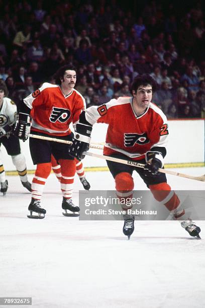 Jim Watson of the Philadelphia Flyers plays against the Boston Bruins .