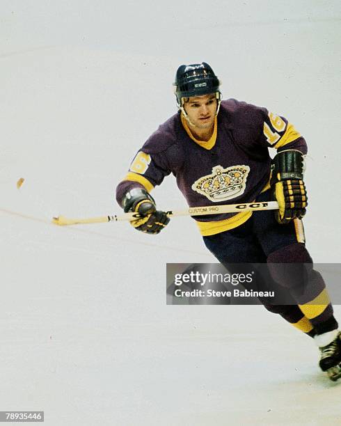 Marcel Dionne of the Los Angeles Kings plays against the Boston Bruins .