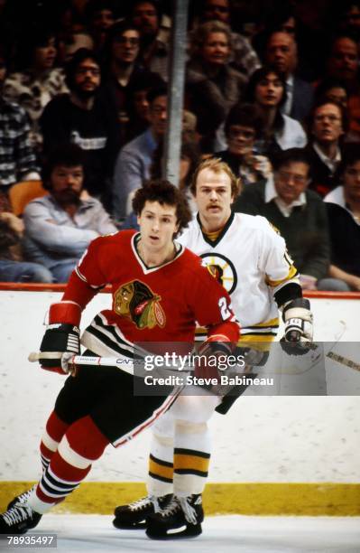 Doug Wilson of the Chicago Blackhawks plays against the Boston Bruins .