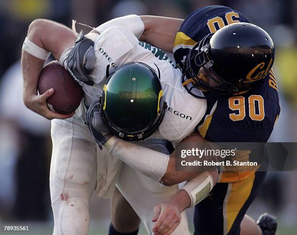 Oregon quarterback Kellen Clemens is tackled by Cal defensive end Ryan Riddle in the fourth quarter as the California Golden Bears defeated the...