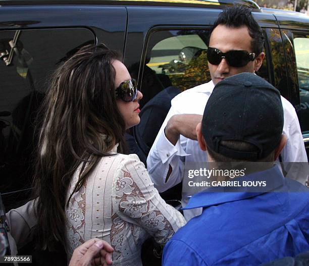 Britney Spears arrives with her boyfriend Adnan Ghalib at the Los Angeles County Superior courthouse 14 January 2008 for a hearing regarding...