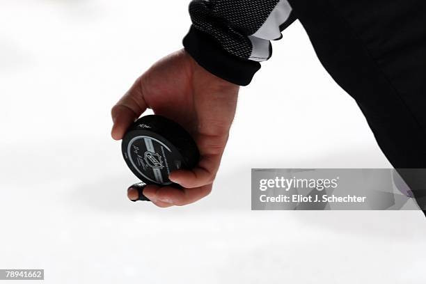 The referee holds the puck prior to a face off while the Florida Panthers play the Colorado Avalanche at the Bank Atlantic Center on January 13, 2008...