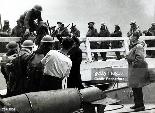 British troops being helped board rescue craft from the pier, The Battle of Dunkirk during World War II, (which took place approx, 25th May - 3rd...