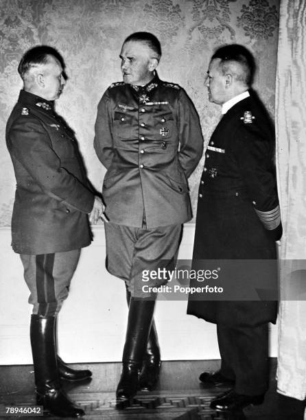 Senior German military personnel, left-right, General Werner von Fritsch , General Werner von Blomberg and Admiral Erich Raeder discuss operational...