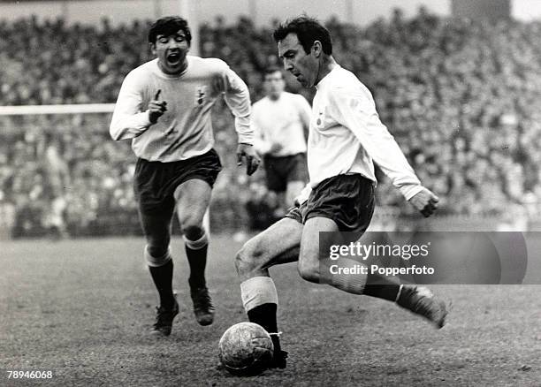 1st April 1967, Division 1, Tottenham Hotspur v Liverpool at White Hart Lane, Tottenham Hotspur's Jimmy Greaves, right, prepares to shoot as...