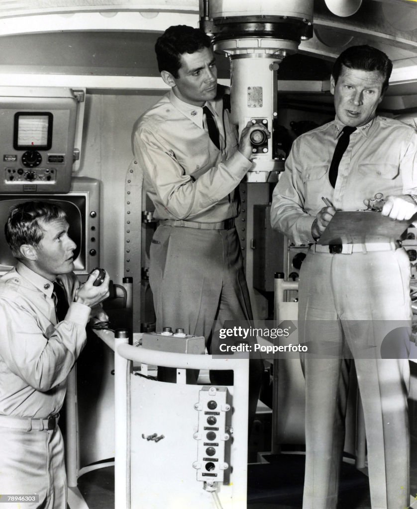 Cinema / TV. Personalities. pic: circa 1964. American actor Richard Basehart (1914-1984) right, pictured making the TV. series "Voyage To The Bottom Of The Sea" with Bob Dowdell and David Hedison.