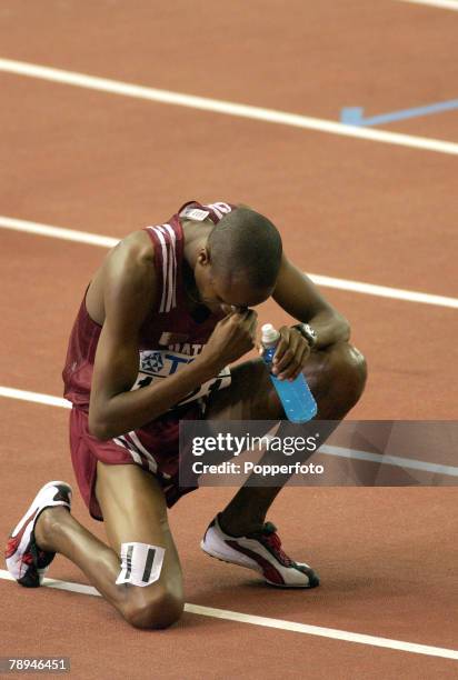 9th World Championships in Athletics, Paris, France, 26th August 2003, Mens 3000m Steeplchase Final, Saif Saaeed Shaheen of Qatar knells down to pray...