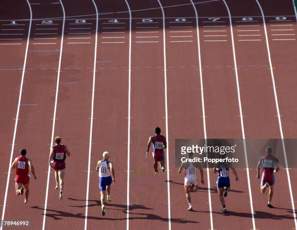 9th World Championships in Athletics, Paris, France, 26th August 2003, Mens 100m Heats, Competitors during the race with the finishing line in view